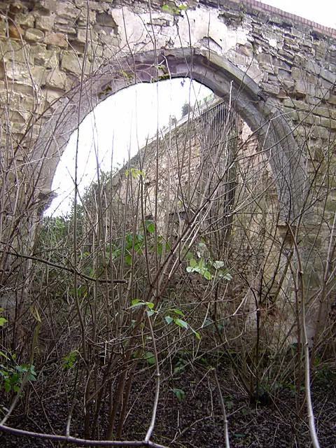Former church of St John the Baptist, Colwick The chancel arch showing the invasion of vegetation