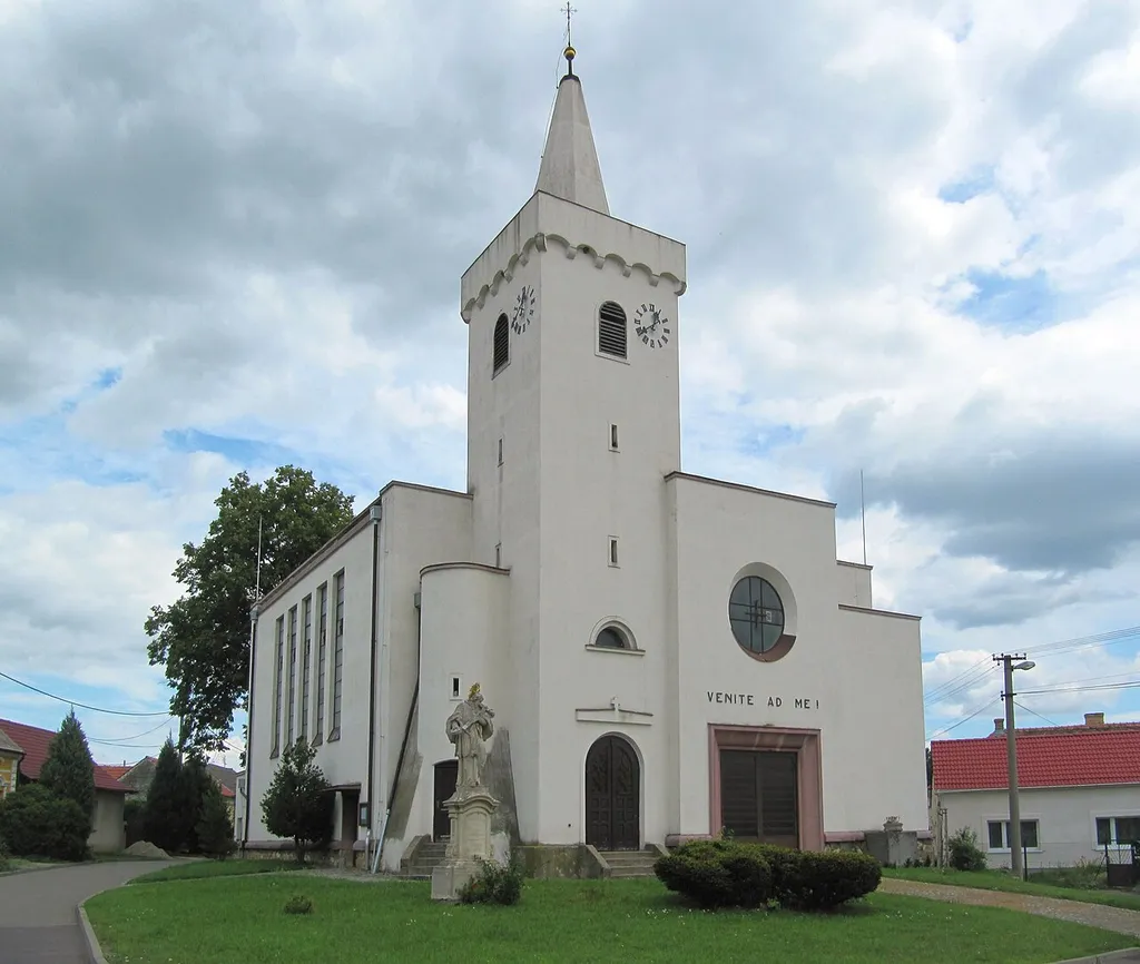 Jevišovka in Břeclav District, Czech Republic. Church of the Holy Kunigunde, original church was rebuilt in the years 1929-1932 in the functionalist style, the Gothic tower (the rest of the original building) and the Baroque statue of St. John of Nepomuk.