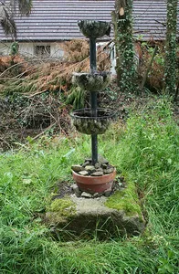 Wayside cross socket stone  at road junction 70m east of St Peter's Church