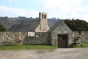 Lychgate at Church of St Mary with churchyard walls including former Bierhouse and store