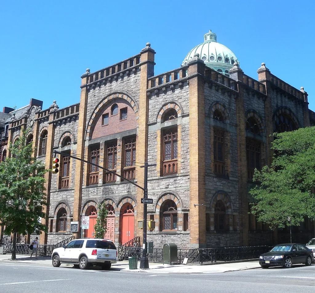 Looking west at church on a sunny midday, with dome.
