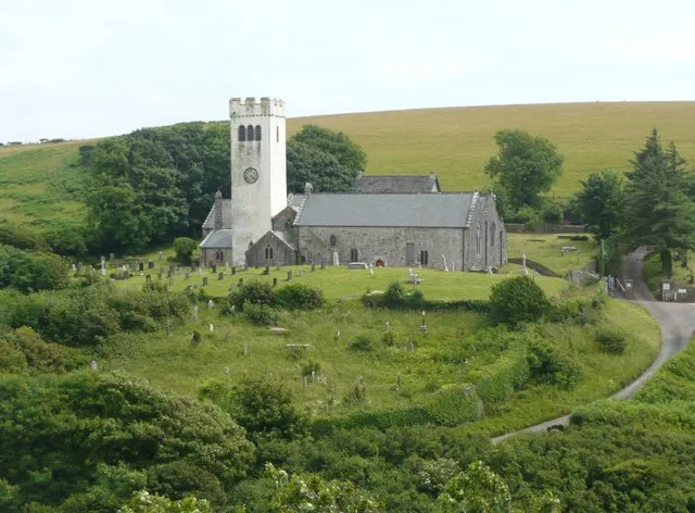 St James's Church, Manorbier 12C church restored by F Wehnert in 1865, when the rood screen was removed and the E window replaced by the present one. The entrance is via a vaulted porch with a medieval painting. The Norman nave has strong walls into which arches have been formed to the 14C aisles. The tower is in an unusual position in the angle between the chancel, rebuilt 13C, and the N transept.