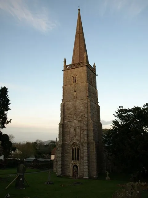 West tower and spire of the parish church of St Mary the Blesséd Virgin, East Brent, Somerset, seen from the southwest