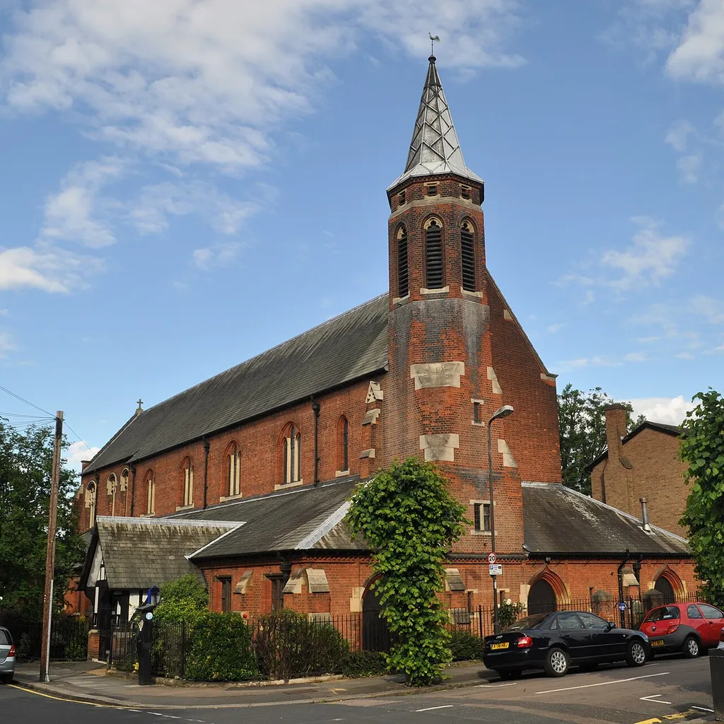 St Luke's parish church, Wimbledon Park, London SW19, seen from the west at the junction of Ryfold Road (left) and Farquhar Road (right)