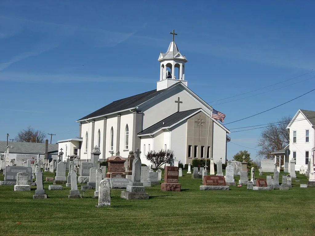 Front of Holy Family Catholic Church, located on the southern side of State Route 185 in Frenchtown, an unincorporated community in Wayne Township, Darke County, Ohio, United States. Built in 1866, the church was added to the National Register of Historic Places as a part of the Cross-Tipped Churches of Ohio Thematic Resources.