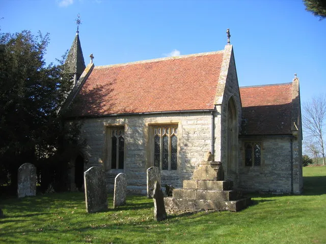 St Milburga's parish church, Wixford, Warwickshire. Centre right is the base and broken stump of the 15th-century churchyard cross.