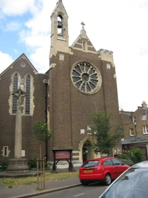 Parish church of the Holy Spirit, Narbonne Avenue, Clapham, London SW4, seen from the southwest. The crucifix on the left is the parish war memorial.