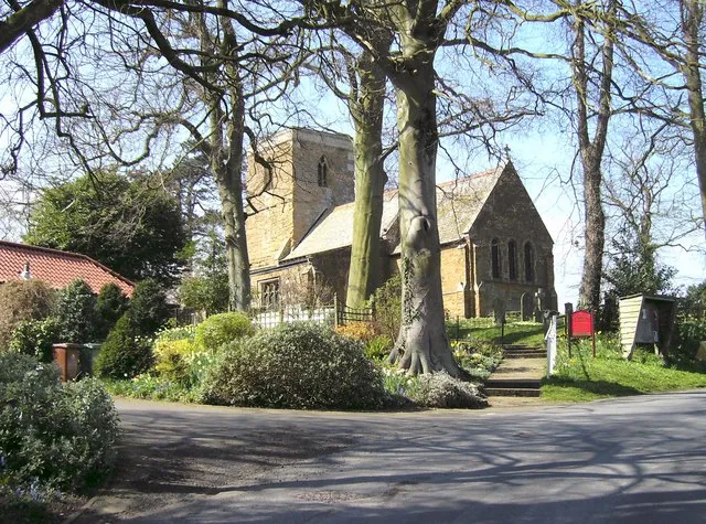St. Andrews Church, Irby-upon-Humber As seen from the main entrance and surrounded by trees and foliage.
