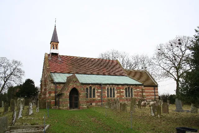 St.Oswald's church, Strubby, Lincs. Striations of greenstone and brick give St.Oswald's a distinctive appearance. Mostly 1857 by Maughan &amp; Fowler and a chancel of 1874 by Ewan Christian, but inside a medieval south arcade, font and south asile E window.