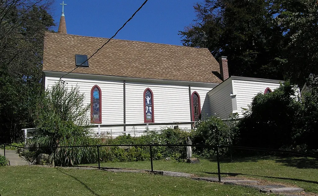 A photograph of St. John's Wilmot Church at the corner of North Avenue and Wilmot Road at the north end of New Rochelle, New York. This church dates to the year 1859.