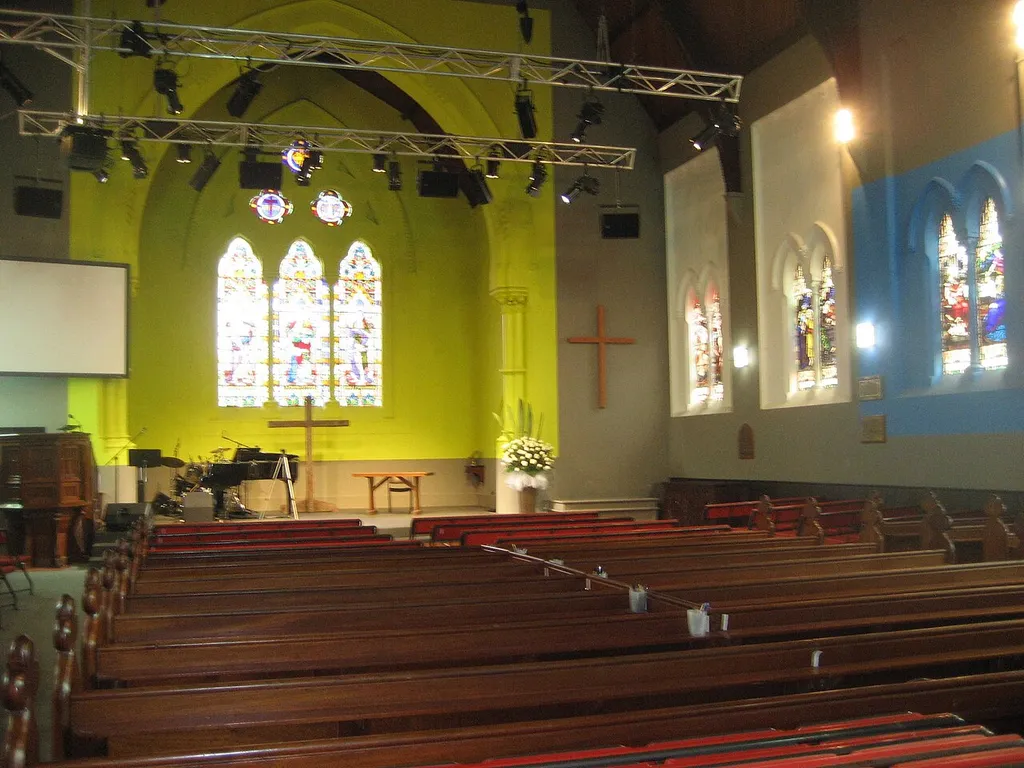 interior of St Jude's showing stained glass windows