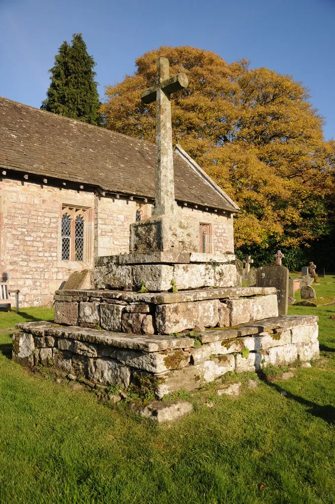 Restored preaching cross in the churchyard of St Aeddan's church in Bettws Newydd.