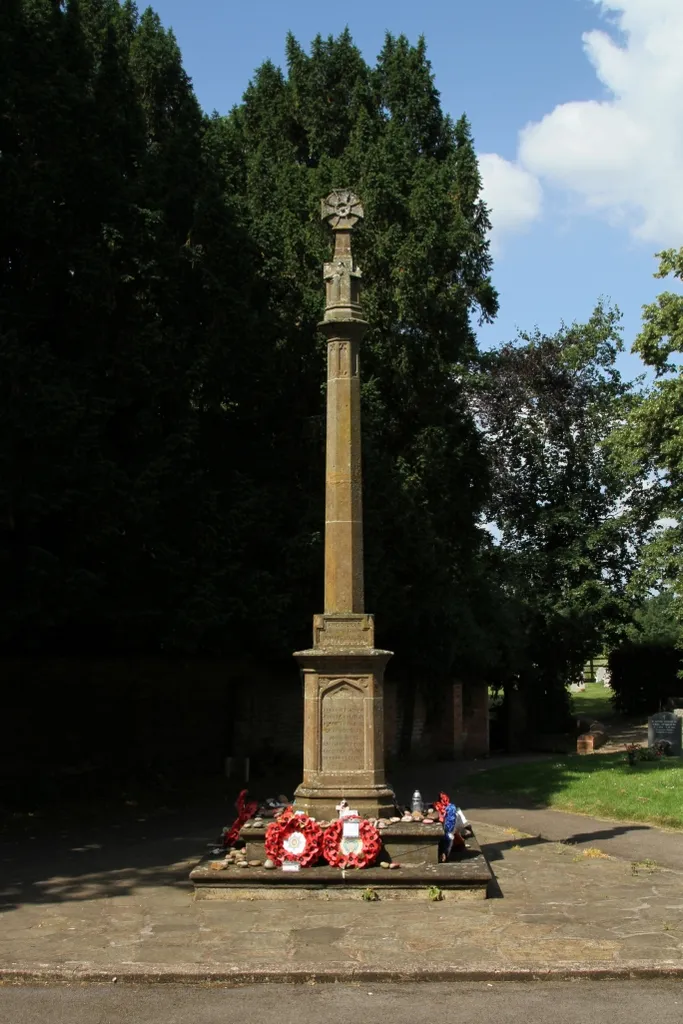 First World War monument in St Peter's parish churchyard, Wellesbourne, Warwickshire, seen from the west