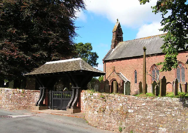 Parish Church, Gosforth. The well preserved viking cross is visible to the left of the wicket gate.