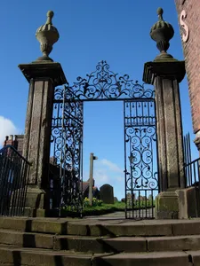 Gates, overthrow, side screen gatepiers and steps, with handrails at south east corner of churchyard