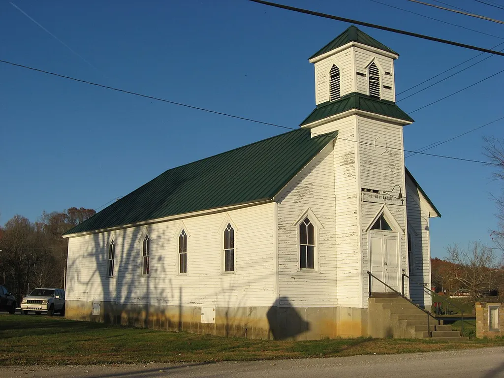 Front and western side of the First Baptist Church, located on the northwestern corner of the junction of Elm and Sinclair Streets in West Baden Springs, Indiana, United States. Built in 1920, it is listed on the National Register of Historic Places.