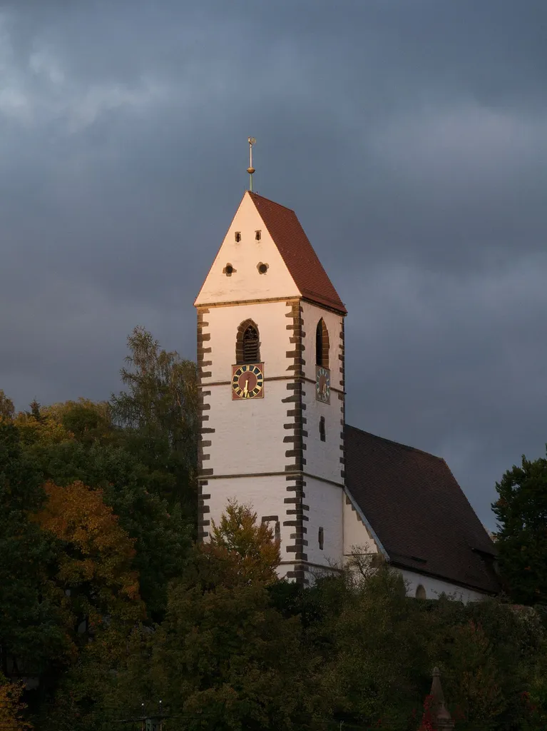 View of the Evangelische Stadtkirche (Protestant City Church) in Plochingen, Baden-Württemberg, Germany, in evening light just before sunset (seen from the Bruckenwasen on the south side of the river Neckar).