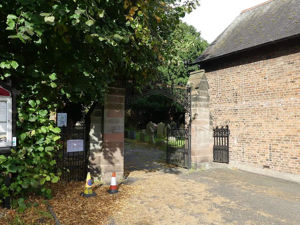 Grade II listed church gate and wall in Hawarden, Flintshire. Listed as "Entrance Gates and Churchyard Walls at Saint Deiniol's Parish Church, Church Lane (Far End)". .mw-parser-output .messagebox{margin:4px 0;width:auto;border-collapse:collapse;border:2px solid var(--border-color-progressive,#6485d1);background-color:var(--background-color-neutral-subtle,#fbfcff);color:var(--color-base,#202122);box-sizing:border-box;border-inline-start-width:8px}.mw-parser-output .messagebox.mbox-small{font-size:88%;line-height:1.25em}.mw-parser-output .mbox-warning,.mw-parser-output .mbox-speedy{border:2px solid var(--border-color-error,#b22222);background:var(--background-color-error-subtle,#ffdbdb);border-inline-start-width:8px}.mw-parser-output .mbox-serious,.mw-parser-output .mbox-delete,.mw-parser-output .mbox-stop{border:2px solid var(--border-color-error,#b22222);border-inline-start-width:8px}.mw-parser-output .mbox-issue,.mw-parser-output .mbox-content{border:2px solid #f28500;background:var(--background-color-warning-subtle,#ffe);border-inline-start-width:8px}.mw-parser-output .mbox-query,.mw-parser-output .mbox-style{border:2px solid #f4c430;background:var(--background-color-warning-subtle,#ffe);border-inline-start-width:8px}.mw-parser-output .mbox-shit{border:2px solid #960;border-inline-start-width:8px}.mw-parser-output .mbox-license{border:2px solid #88a;border-inline-start-width:initial}.mw-parser-output .mbox-legal{border:2px solid var(--border-color-notice,#666);background:var(--background-color-base,#fff);border-inline-start-width:8px}.mw-parser-output .mbox-honor{border:2px solid #ca3;background:var(--background-color-warning-subtle,#fcf4db);border-inline-start-width:8px}.mw-parser-output .mbox-growth{border:2px solid #8d4;background:var(--background-color-success-subtle,#d5fdf4);border-inline-start-width:8px}.mw-parser-output .mbox-move{border:2px solid #93c;border-inline-start-width:8px}.mw-parser-output .mbox-protection,.mw-parser-output .mbox-message{border:2