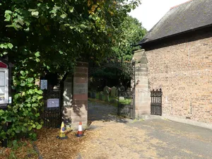 Entrance gates and churchyard walls at Saint Deiniol's Parish Church, Church Lane (far end)