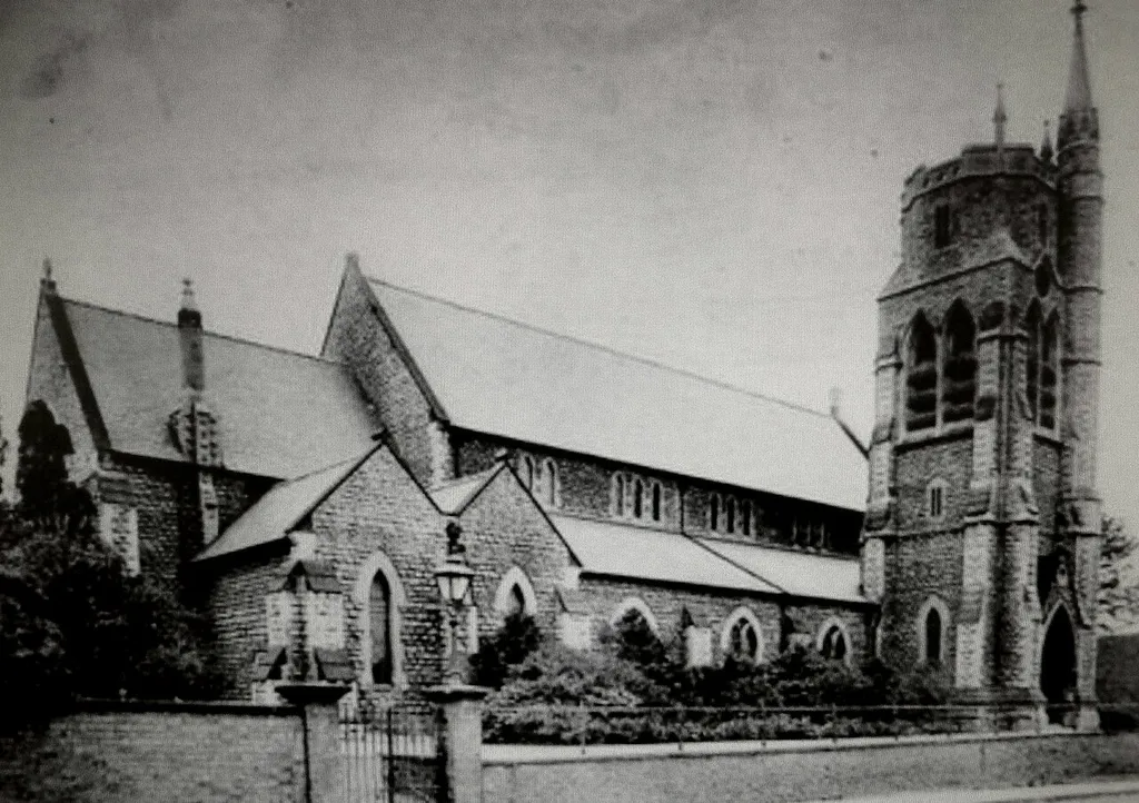 Pre-1914 image of Holy Trinity church, Louth, Lincolnshire, England. Later the nave burned down and only the tower remains. The nave was replaced by a modern-style community centre.