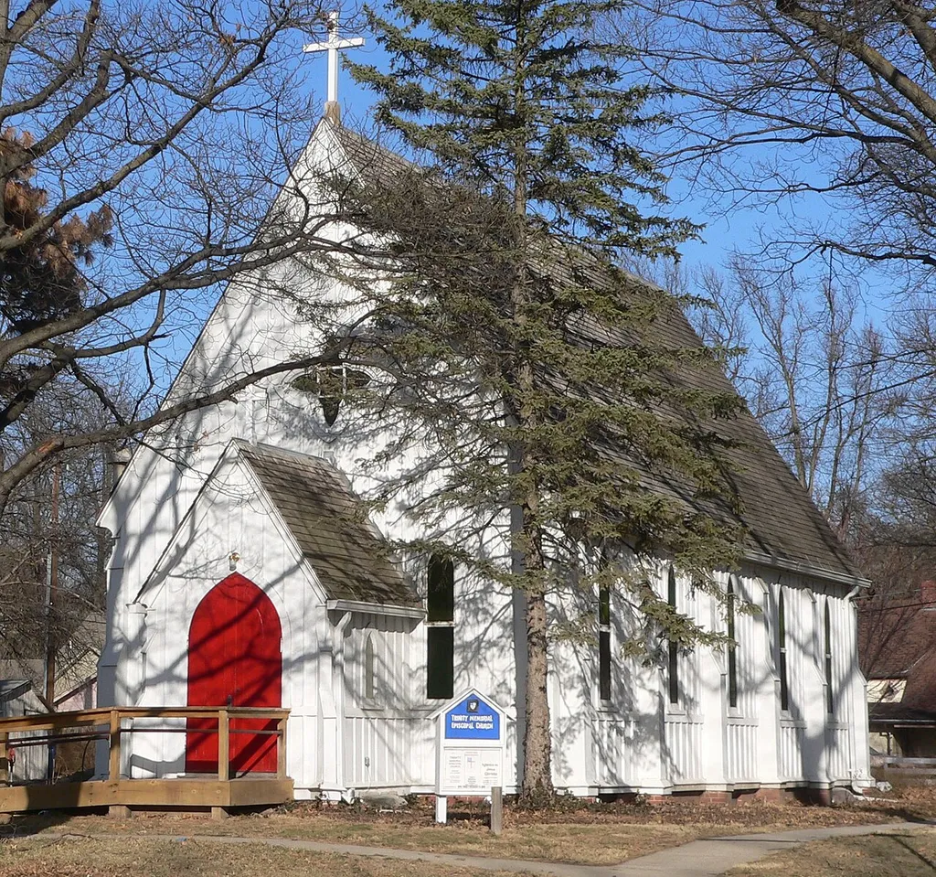 Trinity Memorial Episcopal Church, located at northeast corner of 14th Street and Juniper Avenue in Crete, Nebraska; seen from the southwest.