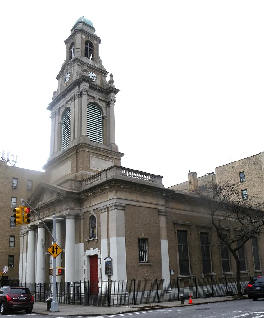 Looking northeast across 174th St and Wadsworth Avenue at Ft Washington Heights Presbyterian Church on a cloudy midday.