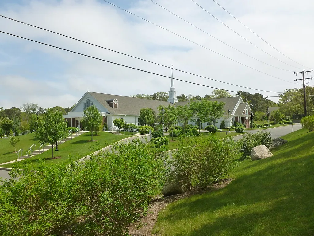 Our Lady of the Cape Catholic Church, located at 468 Stony Brook Road Brewster, Massachusetts 02631-1021. North (front) and east sides of building shown.