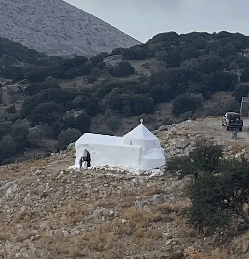 view from a distance of Agios Efstathios medieval chapel in Naxos, freshly whitewashed two days before the saint's festival on 20 September