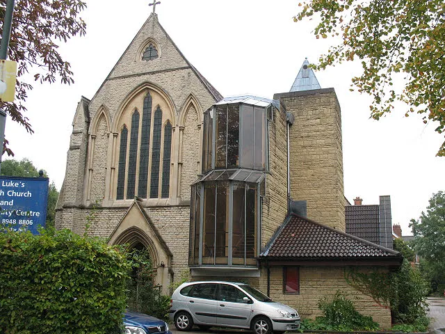 St Luke's church, Kew - west end This church on The Avenue was built in 1889 and is not listed. It was originally called St Luke, North Sheen but the parish name was later changed to Kew, perhaps to reflect its location close to Kew Gardens. The modern glazed stairwell and other additions to the west end date from 1983 when the nave was converted into a community centre [link].