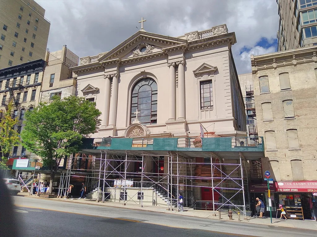 Looking north across 96th Street at Catholic church on a sunny midday
