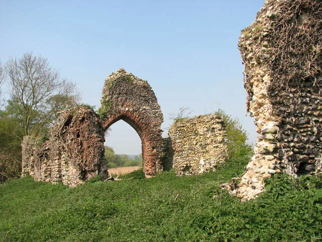 The ruins of St Saviour's church. Dating from the 12th century, St Saviour's church was in regular use until about the year 1705. The ruin is not marked on OS maps. Little is known of the parish of St Saviour's except that two buildings once used to stand here - the church and a barn which has not survived. Some of the gravestones were moved to St Mary's and others have disappeared with the passage of time. In more recent times the writer and naturalist Ted Ellis (1909-1986) was buried here > https://www.geograph.org.uk/photo/1280803. Edward Augustine Ellis lived in a cottage at Wheatfen Broad with his wife Phyllis for 40 years. He set up his own nature reserve on the 130 acre site comprising woodland, fen and marshland. From 1928-1956 he was the Keeper of Natural History at the Norwich Castle Museum but at the age of 47 he resigned to concentrate on his work as a naturalist. He had an extensive knowledge of the wildlife and eco-systems of the Norfolk Broads and eventually became know as 'the people's naturalist'. http://www.wheatfen.org/tethtml/tet.html