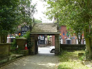 Lychgate and west wall of St Peter's churchyard