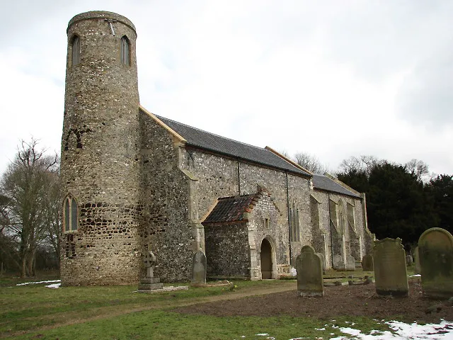 The church of St Lawrence. Situated beside the busy A151 Norwich to Stalham road. The round tower has distinctive carstone detailing and dates to the 12th century. The nave is 14th century > 738948 - 738961 but the church was greatly restored in the 18th century, when the Preston family of Beeston Hall > 738973 took it upon themselves to turn the church into their mausoleum. During this time the interior received its ceiling with Gothick panelling, which imitates that in the entrance of Beeston Hall. The church contains many wall monuments to members of the Preston family > 738949 - 738951; the tomb chest is to Jacob Preston (d. 1683) > 738952. After having been closed to the public due to re-roofing and interior restoration work the church is now again open every day. For more information see: http://www.norfolkchurches.co.uk/beestonstlawrence/beestonstlawrence.htm