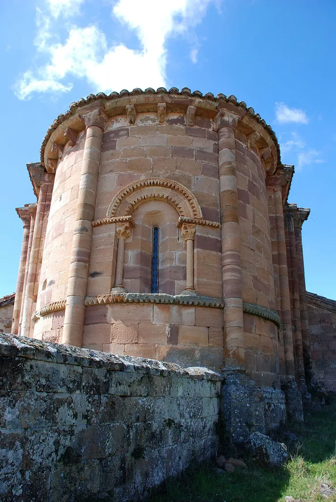 Parish Church of Santa Marina in Villanueva de las Torres, small village in Barruelo de Santullán (Palencia, Castile and León). Dated at the end of the 12th century temple has a single nave surmounted in semicircular apse with two openings beautiful decorated with tips of diamond between two semi-detached columns. The vain central apse is the most interesting and leads a double-headed diamond resting on cimacios of tips of diamond supported by two columns whose capitals are decorated with hipocrifos, half Eagle frieze and half horse, as guardians of the place. The vain of the south wall is very similar but has been partly reconstructed. Appear in the eaves canecillos decorated with human heads, seated characters, geometric figures, etc. It has a robust Square Tower double-decker separated by a shelf. Each side of the upper floor opens a large arch containing vain case. Inside the Church the triumphal arch lays on capitals decorated with the theme of Daniel in the moat of the Lions and confronted taps, as well as an old Baroque altar and a good image of the Virgin with the child in the 13th century.