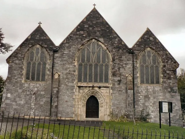 St Simon's parish church, Salisbury Road, Plymouth, Devon, seen from the west. The church was built of local limestone in a Perpendicular Gothic style and consecrated in 1907. Until 1958 still had a temporary corrugated iron wall on the west side. Stone from the demolished Granby Barracks was recycled for the new wall.