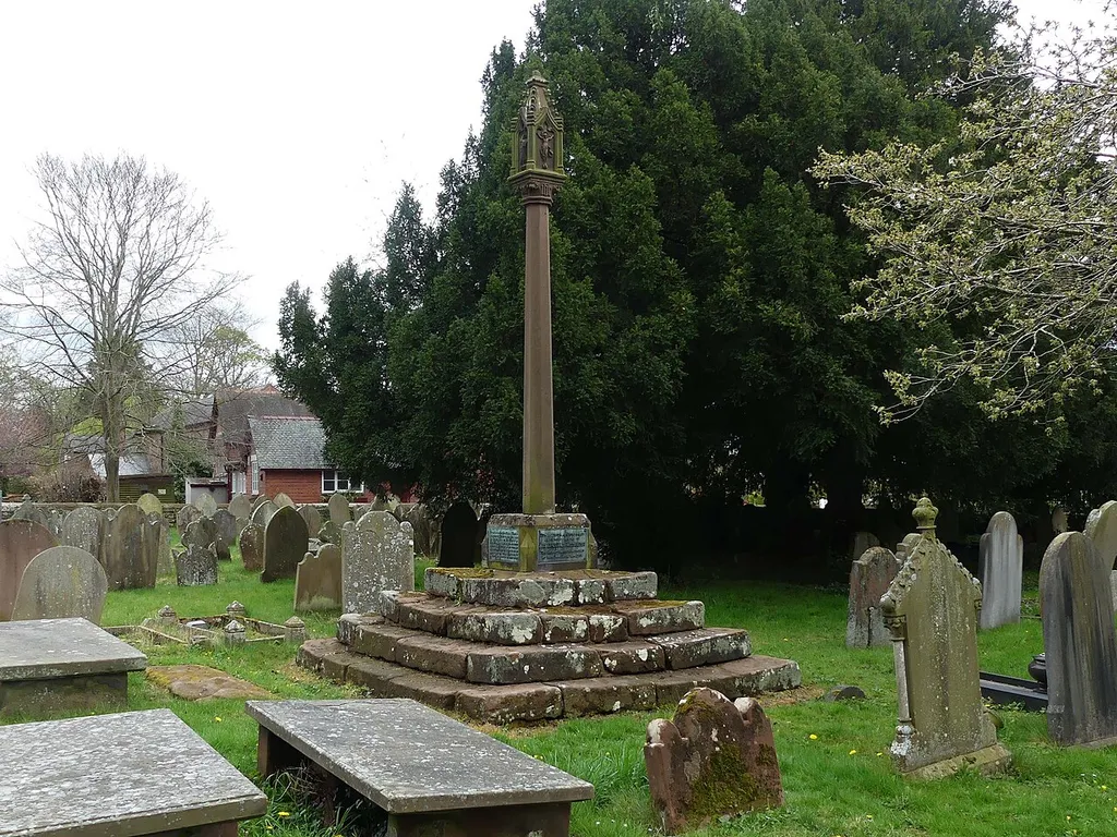 Cross and stepped base east of path to south porch of Church of St John the Baptist: Grade II listed cross in Aldford, Cheshire. .mw-parser-output .messagebox{margin:4px 0;width:auto;border-collapse:collapse;border:2px solid var(--border-color-progressive,#6485d1);background-color:var(--background-color-neutral-subtle,#fbfcff);color:var(--color-base,#202122);box-sizing:border-box;border-inline-start-width:8px}.mw-parser-output .messagebox.mbox-small{font-size:88%;line-height:1.25em}.mw-parser-output .mbox-warning,.mw-parser-output .mbox-speedy{border:2px solid var(--border-color-error,#b22222);background:var(--background-color-error-subtle,#ffdbdb);border-inline-start-width:8px}.mw-parser-output .mbox-serious,.mw-parser-output .mbox-delete,.mw-parser-output .mbox-stop{border:2px solid var(--border-color-error,#b22222);border-inline-start-width:8px}.mw-parser-output .mbox-issue,.mw-parser-output .mbox-content{border:2px solid #f28500;background:var(--background-color-warning-subtle,#ffe);border-inline-start-width:8px}.mw-parser-output .mbox-query,.mw-parser-output .mbox-style{border:2px solid #f4c430;background:var(--background-color-warning-subtle,#ffe);border-inline-start-width:8px}.mw-parser-output .mbox-shit{border:2px solid #960;border-inline-start-width:8px}.mw-parser-output .mbox-license{border:2px solid #88a;border-inline-start-width:initial}.mw-parser-output .mbox-legal{border:2px solid var(--border-color-notice,#666);background:var(--background-color-base,#fff);border-inline-start-width:8px}.mw-parser-output .mbox-honor{border:2px solid #ca3;background:var(--background-color-warning-subtle,#fcf4db);border-inline-start-width:8px}.mw-parser-output .mbox-growth{border:2px solid #8d4;background:var(--background-color-success-subtle,#d5fdf4);border-inline-start-width:8px}.mw-parser-output .mbox-move{border:2px solid #93c;border-inline-start-width:8px}.mw-parser-output .mbox-protection,.mw-parser-output .mbox-message{border:2px solid var(--border-color-base,#aaa)