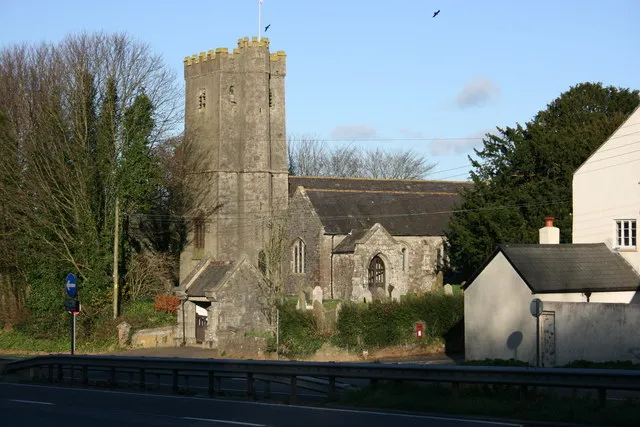 Dean Prior Church. This C14th church is dedicated to St George the Martyr, and the parish stretches westwards out into the centre of Dartmoor. It is situated right on the side of the busy A38 Exeter to Plymouth dual carriageway, the barriers of the central reservation can be seen in the foreground, and despite the busy noisy road (the image was taken between vehicles) has services every week. Even the crows cope with the noise! See also 1097695 and 1097728 and church website http://www.deanpriorchurch.co.uk .