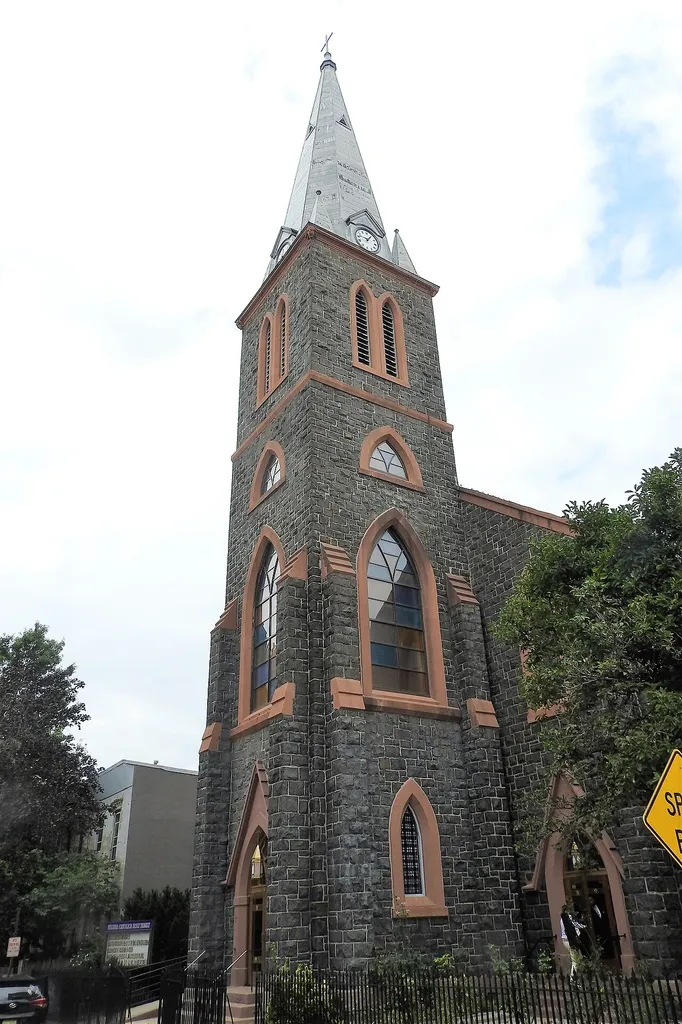 Looking north at steeple on a mostly cloudy day