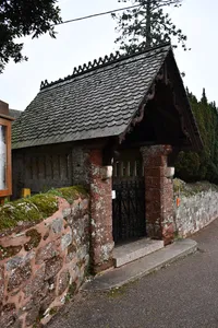 Lychgate And Adjoining Churchyard Wall To South Of Parish Church