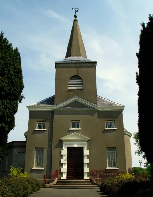 Knockbreda Parish Church, Belfast. Funded solely by the Dowager Viscountess Middleton and designed by the leading architect in Ireland of the time, Richard Castles (or Cassels), the church was consecrated in August 1737. The apsidal chancel was added by Thomas Drew in 1883 and the vestry by R.I. Caldwell CE in 1910. The parish graveyard contains many fine monuments, including late 18th Century mausoleums - see 799564, 799582 and 799612. Many other wealthy or prominent Belfast citizens from the 18th and 19th centuries are also buried here. Alongside the old parish graveyard is the newer Knockbreda Cemetery, still in use today.