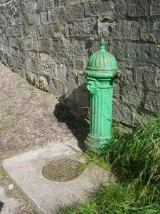 Drinking Fountain Against North-West Corner Of Churchyard Wall