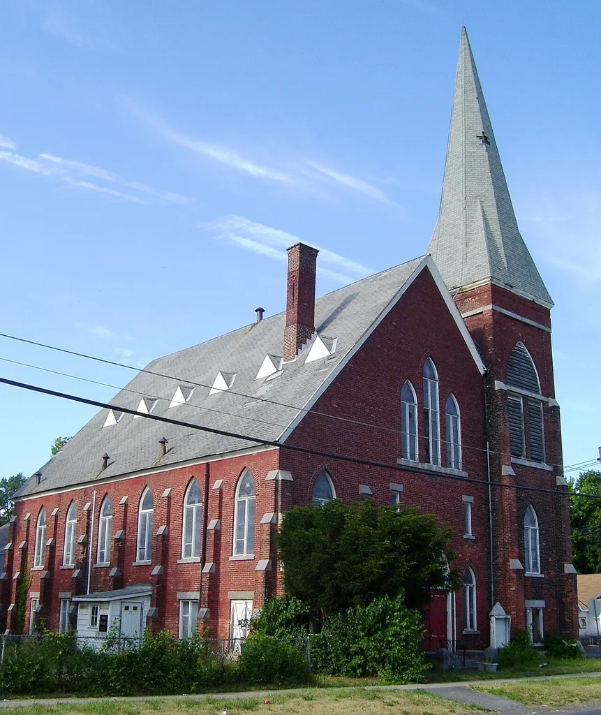 The Wall Street Methodist Episcopal Church, now the home of the African Methodist Episcopal Zion Church, is a historic church located at 69 Wall Street in Auburn, New York. It is a large Gothic Revival style brick and limestone structure built in 1887, an example of an auditorium plan church, popular in church design fron the 1880s to 1920s.