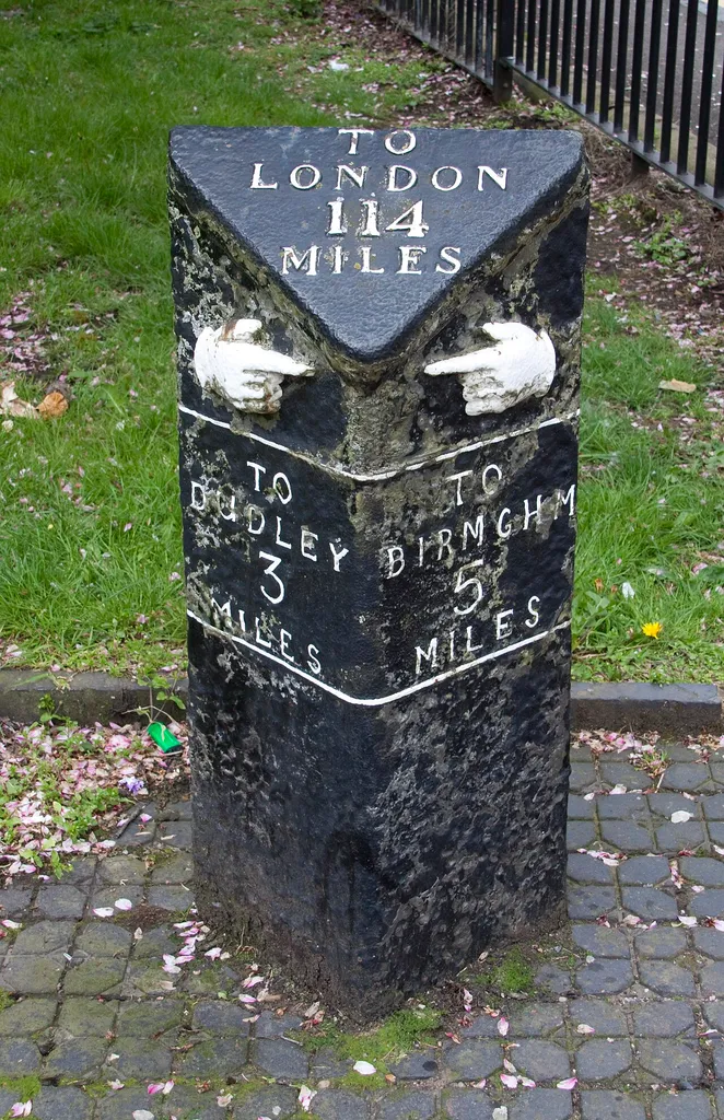 This cast iron mile post is in the Church square Oldbury. It was made about 1800 and is a grade 2 listed building