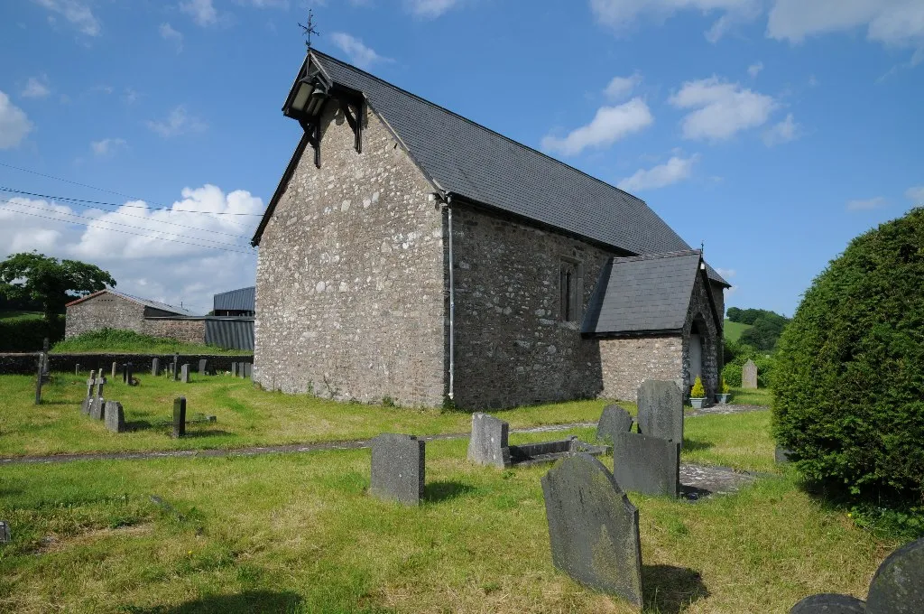 Llanllugan church. St Mary's church in Llanllugan stands in the valley above Afon Rhiw. Rather than a bellcot the bell is shelter under a projection of the main roof.