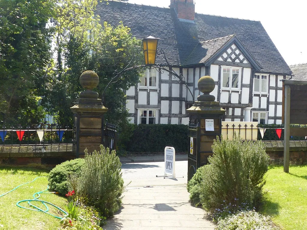 Grade II listed gates, overthrow and gate piers to Church of St Bartholomew, Church Minshull. Building in the background is Church Farm House, also a listed building. .mw-parser-output .messagebox{margin:4px 0;width:auto;border-collapse:collapse;border:2px solid var(--border-color-progressive,#6485d1);background-color:var(--background-color-neutral-subtle,#fbfcff);color:var(--color-base,#202122);box-sizing:border-box;border-inline-start-width:8px}.mw-parser-output .messagebox.mbox-small{font-size:88%;line-height:1.25em}.mw-parser-output .mbox-warning,.mw-parser-output .mbox-speedy{border:2px solid var(--border-color-error,#b22222);background:var(--background-color-error-subtle,#ffdbdb);border-inline-start-width:8px}.mw-parser-output .mbox-serious,.mw-parser-output .mbox-delete,.mw-parser-output .mbox-stop{border:2px solid var(--border-color-error,#b22222);border-inline-start-width:8px}.mw-parser-output .mbox-issue,.mw-parser-output .mbox-content{border:2px solid #f28500;background:var(--background-color-warning-subtle,#ffe);border-inline-start-width:8px}.mw-parser-output .mbox-query,.mw-parser-output .mbox-style{border:2px solid #f4c430;background:var(--background-color-warning-subtle,#ffe);border-inline-start-width:8px}.mw-parser-output .mbox-shit{border:2px solid #960;border-inline-start-width:8px}.mw-parser-output .mbox-license{border:2px solid #88a;border-inline-start-width:initial}.mw-parser-output .mbox-legal{border:2px solid var(--border-color-notice,#666);background:var(--background-color-base,#fff);border-inline-start-width:8px}.mw-parser-output .mbox-honor{border:2px solid #ca3;background:var(--background-color-warning-subtle,#fcf4db);border-inline-start-width:8px}.mw-parser-output .mbox-growth{border:2px solid #8d4;background:var(--background-color-success-subtle,#d5fdf4);border-inline-start-width:8px}.mw-parser-output .mbox-move{border:2px solid #93c;border-inline-start-width:8px}.mw-parser-output .mbox-protection,.mw-parser-output .mbox-message{border:2