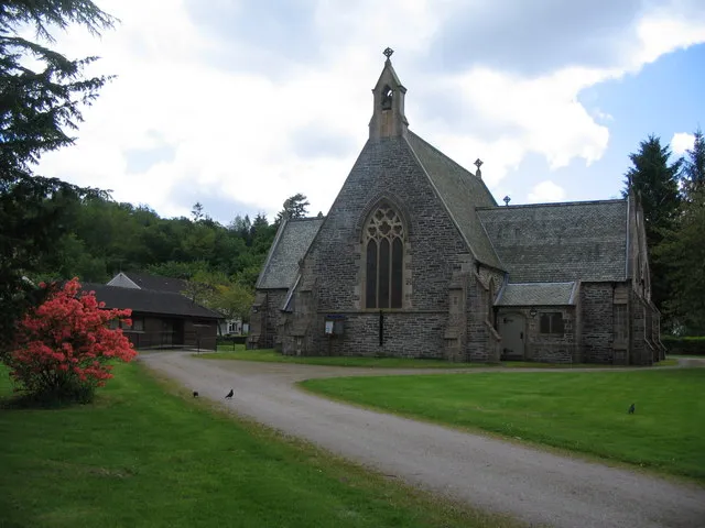St. Modans, Rosneath. A view looking west from Tom-a-Mhoid towards the church of St. Modan. A plaque at the entrance to the churchyard states " There has been a Christian church in Rosneath since the time of St. Modan in the 7th century. Near the present Church are the ruins of an earlier sanctuary surrounded by an Historic Churchyard."