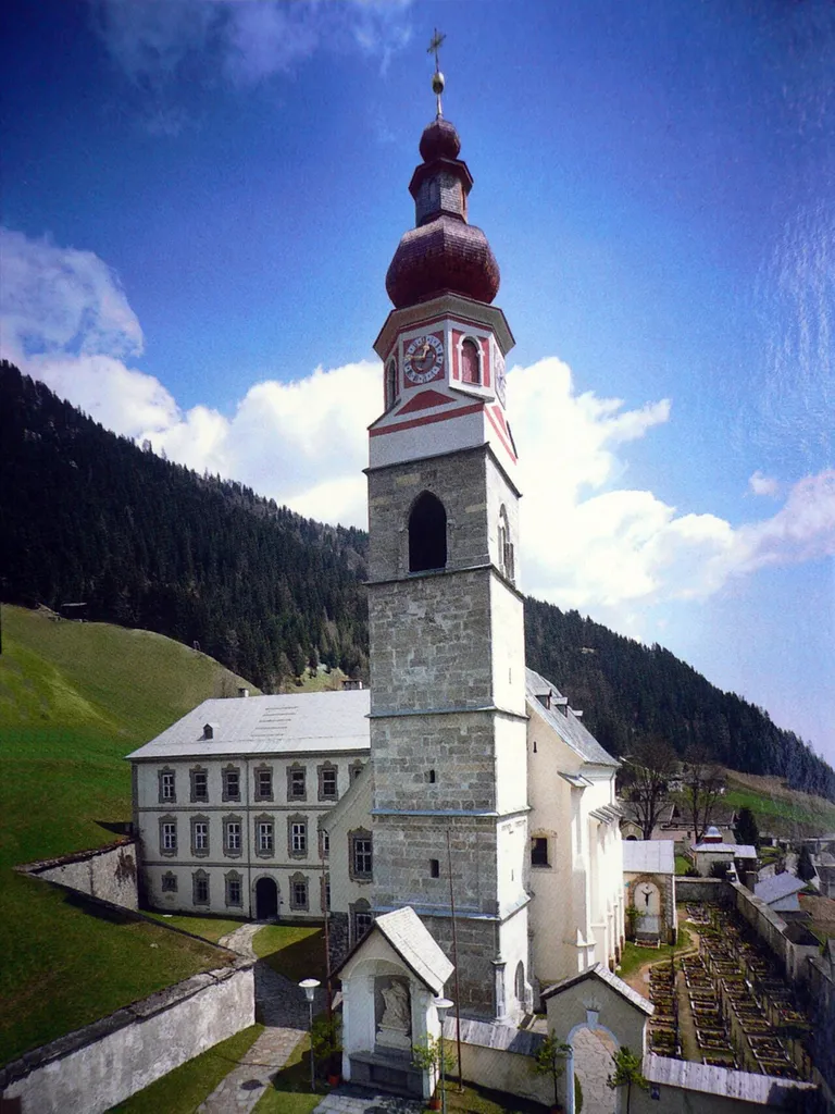 Maria Luggau, pilgrimage church Saint Mary`s Our Lady of the Snows and the monastery (left)