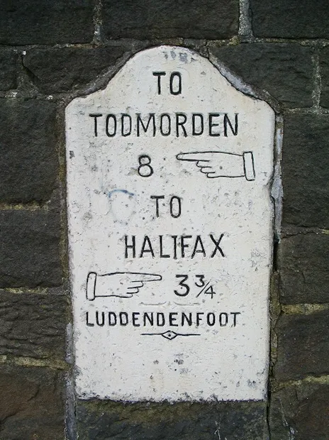 Milestone Set in the wall opposite the former church on Burnley Road