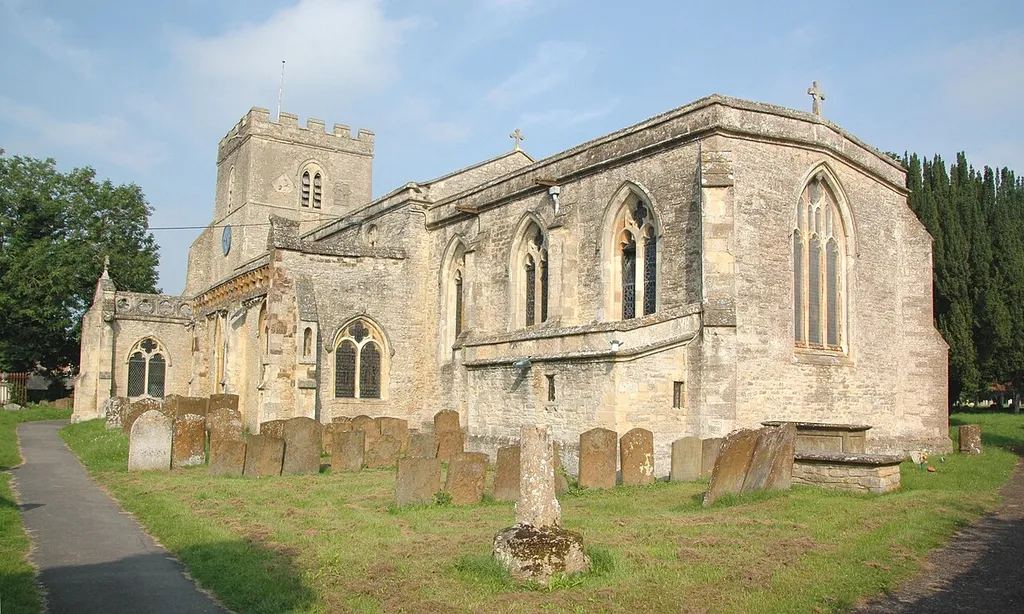 St Mary the Virgin parish church, Ambrosden, Oxfordshire: view from the southeast, with the remains of the churchyard cross in the foreground