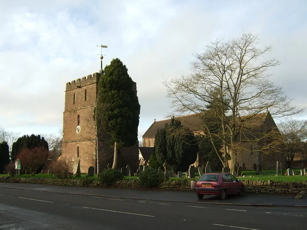 The church and the bell tower viewed from the crossroads.